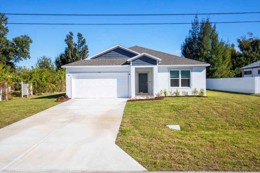 Front exterior of a new home in Cape Coral, Cape Coral, FL, highlighting curb appeal (Image 21).