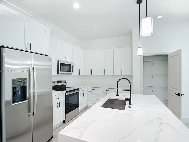 Furnished interior view inside a new home in , Port Charlotte (Image 9).