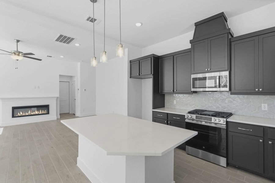 Representative furnished interior of a home built from the Chantilly 2 by Chesmar Homes in Sienna Chateau, Missouri City (Image 7).