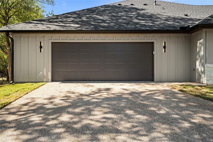 Garage featuring driveway