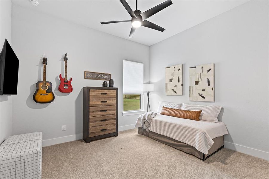 Bedroom featuring carpet floors and ceiling fan