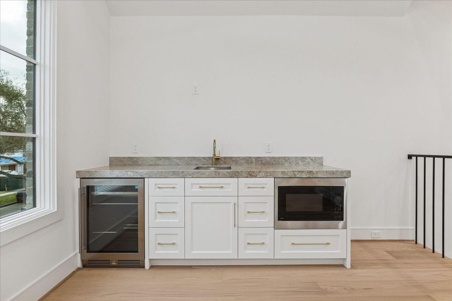 Furnished interior view inside a new home in , West University Place (Image 12).