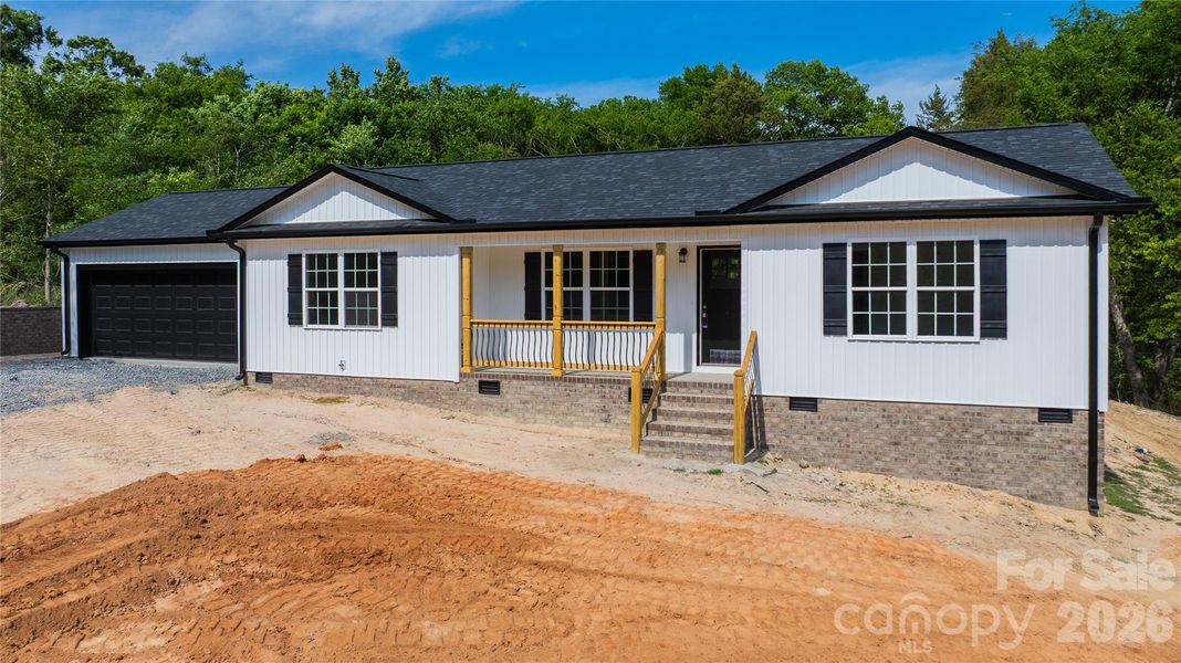 Covered, concrete front porch