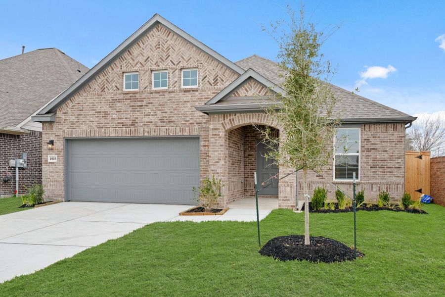 Front exterior of a new home in Lago Mar, Texas City, TX, highlighting curb appeal (Image 18).