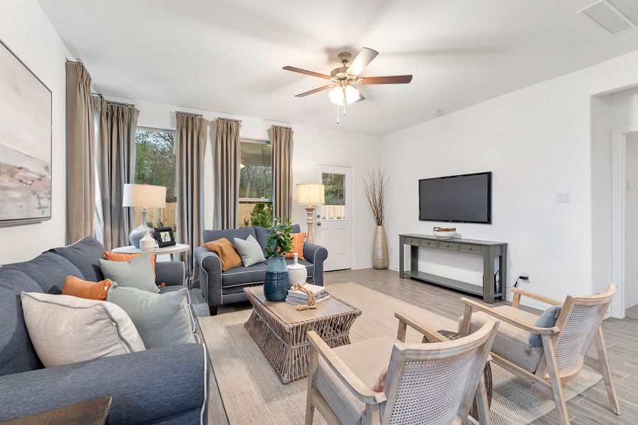 A living room with a tv and couches.
