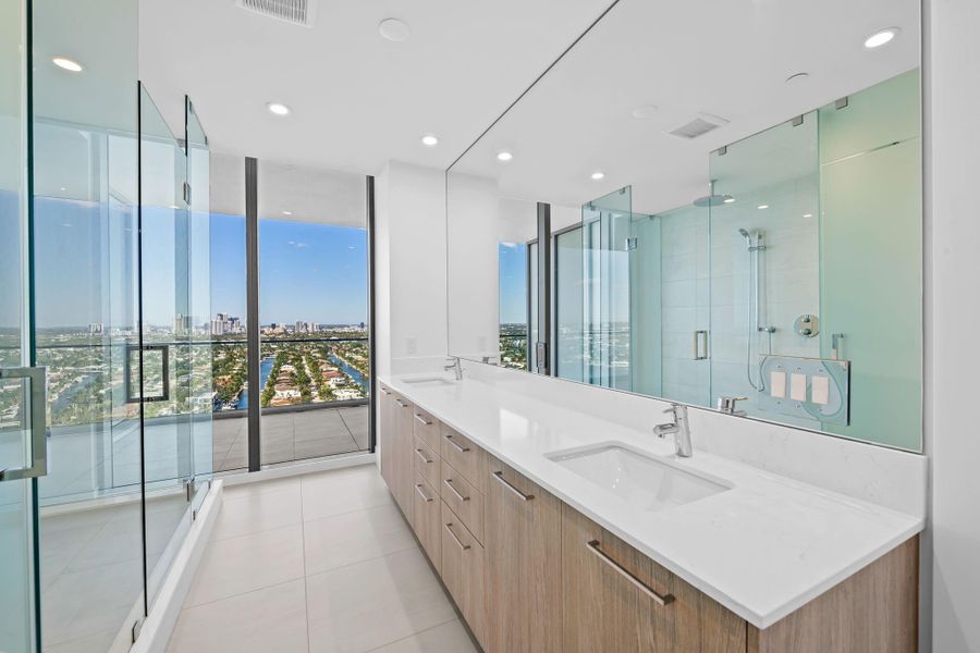 Primary suite bathroom with unobstructed Intracoastal and city view Primary suite bathroom with unobstructed Intracoastal and city view