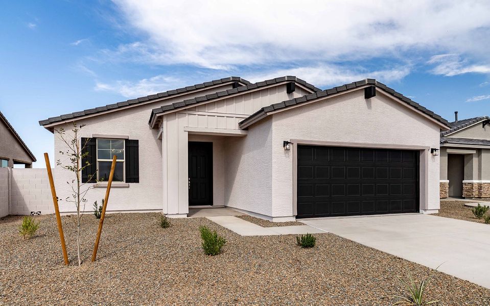 Front exterior of a new home in Rancho Santa Rosa, Maricopa, AZ, highlighting curb appeal (Image 2).
