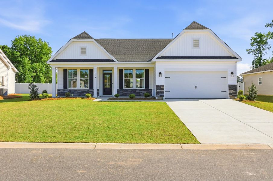 Front exterior of a new home in Oak Hollow, Longs, SC, highlighting curb appeal (Image 1). Front exterior of a new home in Oak Hollow, Longs, SC, highlighting curb appeal (Image 1).