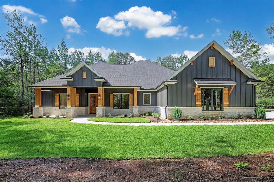 Welcome home to 7582 Saddle Blanket Drive. Beautiful stone, pine pillars and aluminum exterior combine to create a welcoming atmosphere.