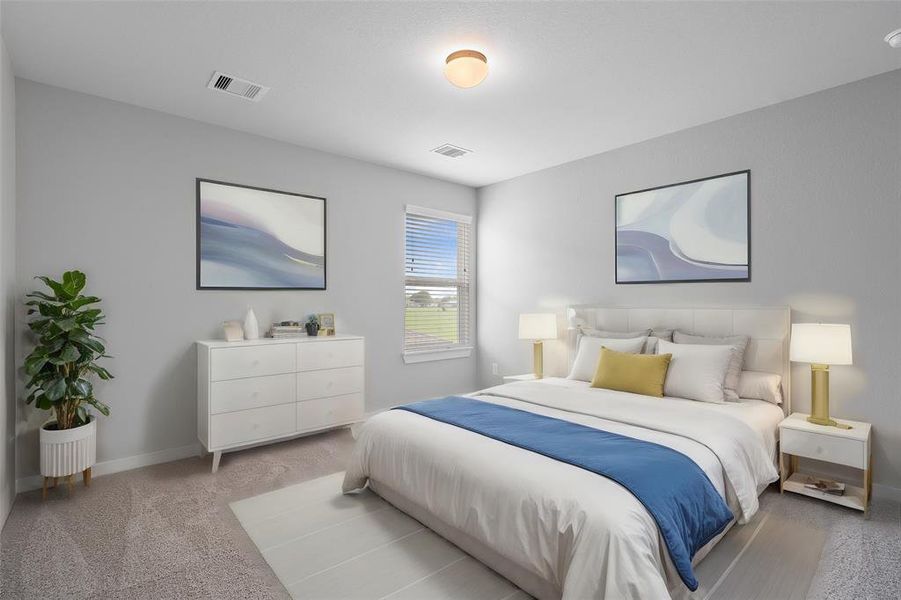 Secondary bedroom features plush carpet, custom paint and a large window with privacy blinds.