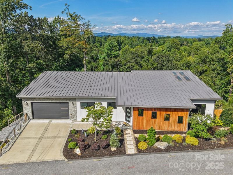 Front exterior of a new home in , Hendersonville, NC, highlighting curb appeal (Image 23).