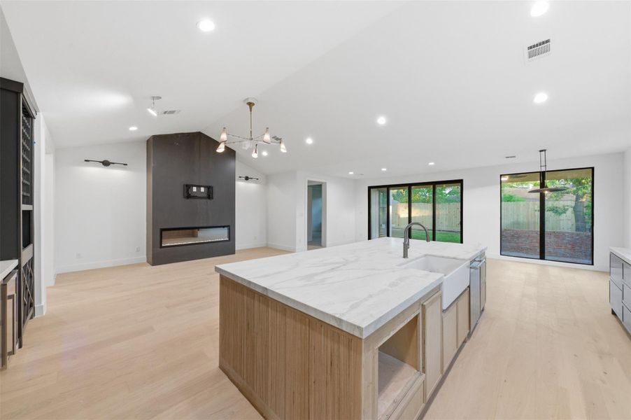 Designed to impress, this chef-inspired kitchen features a massive island perfect for entertaining, dining, and everyday living.