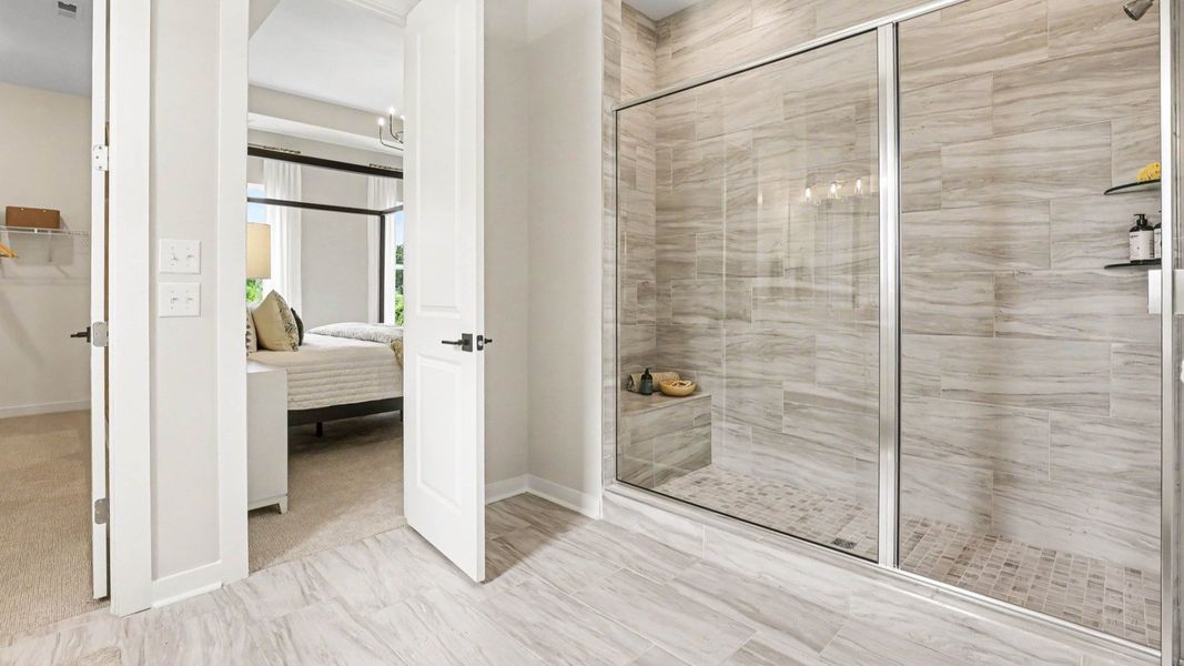 Primary bathroom with glass enclosed shower