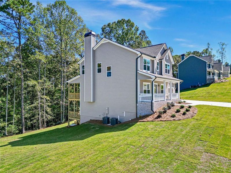 Exterior details and patio area of a home in Woodland Hills, Loganville (Image 3).