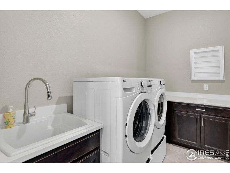 Spacious Laundry Room located right next to the primary bedroom closet