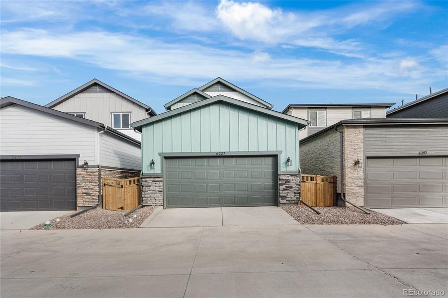 Exterior details and patio area of a home in Painted Prairie, Aurora (Image 4).
