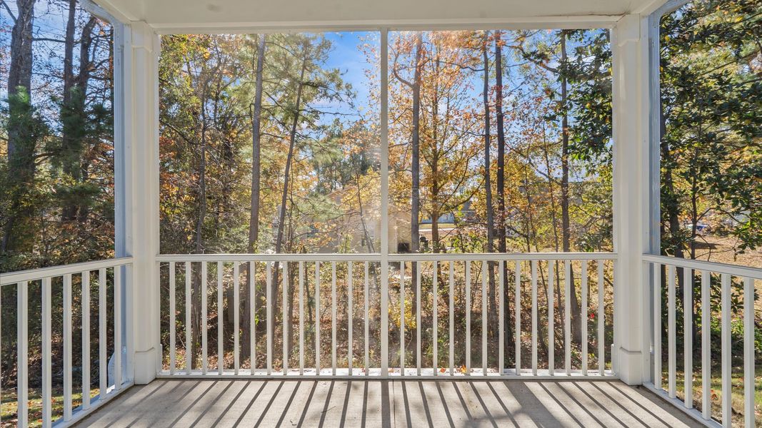 Warm and inviting outdoor living space with a screened rear porch and tasteful finishes Warm and inviting outdoor living space with a screened rear porch and tasteful finishes