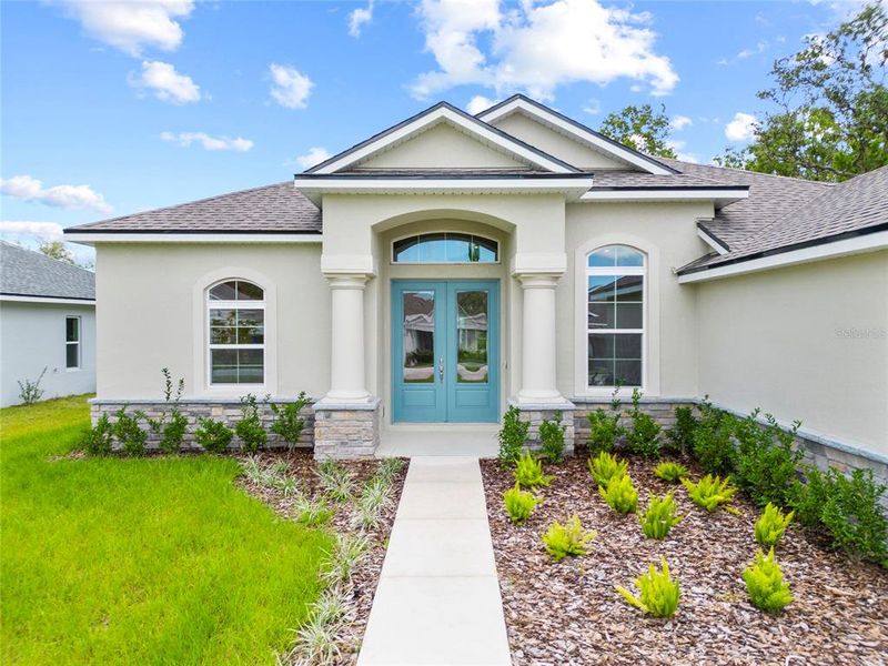 Front exterior of a new home in , Homosassa, FL, highlighting curb appeal (Image 2).