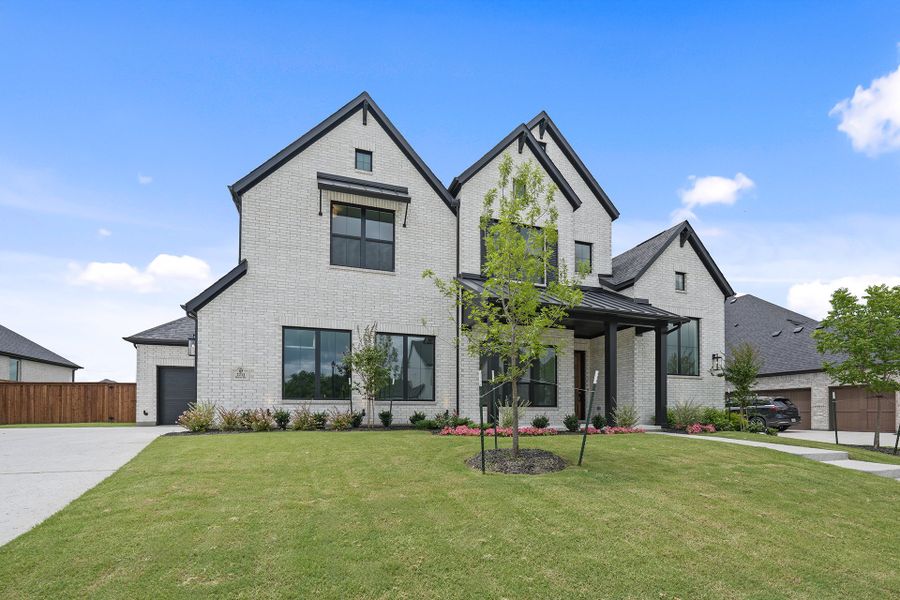 Front exterior of a new home in Winding Creek, Rockwall, TX, highlighting curb appeal (Image 29). Front exterior of a new home in Winding Creek, Rockwall, TX, highlighting curb appeal (Image 29).