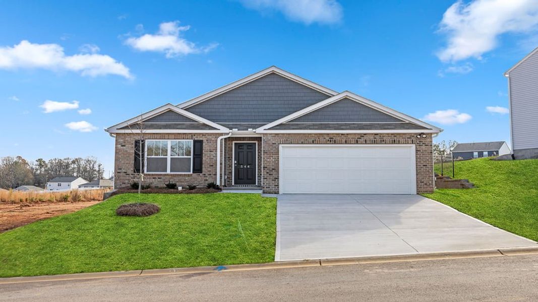 Front exterior of a new home in Lakestone, Woodruff, SC, highlighting curb appeal (Image 1).