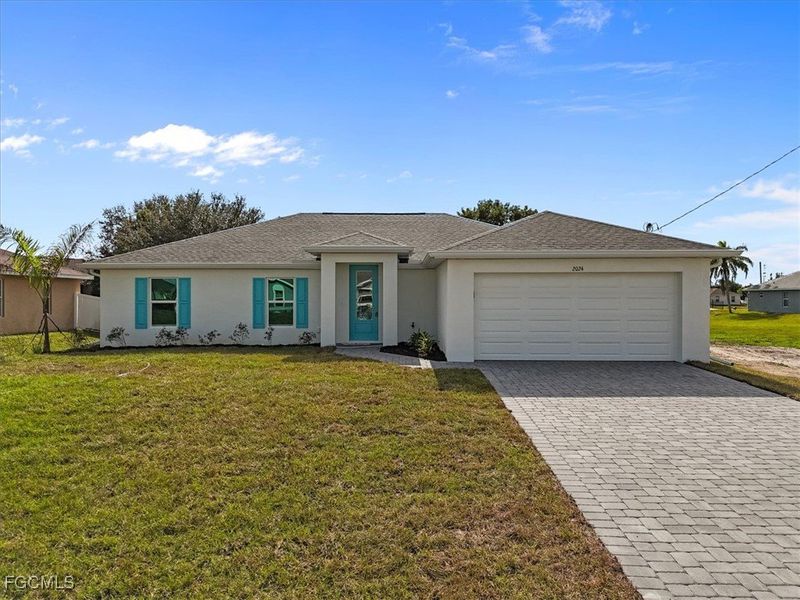 Front exterior of a new home in Cape Coral, Cape Coral, FL, highlighting curb appeal (Image 1).
