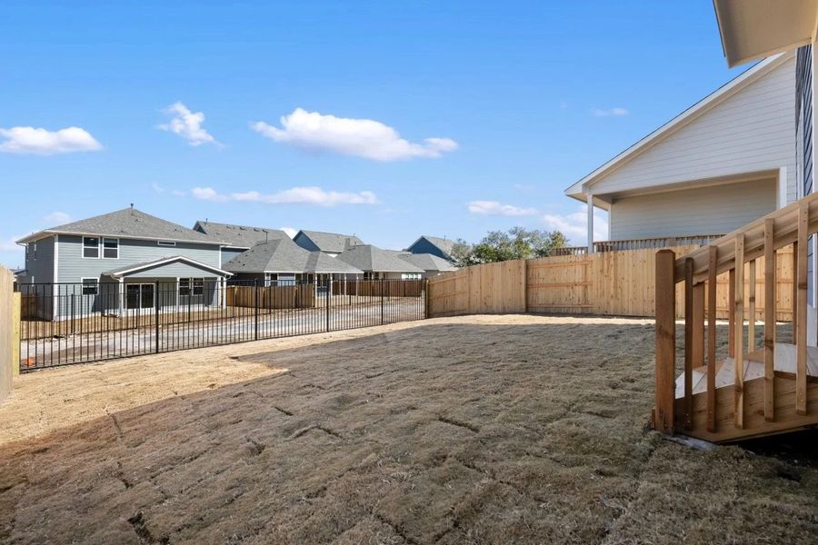 Exterior details and patio area of a home in Cannon Ranch, Dripping Springs (Image 28).
