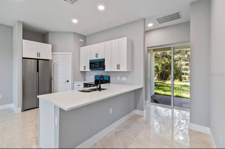 Furnished interior view inside a new home in , Port Charlotte (Image 6).