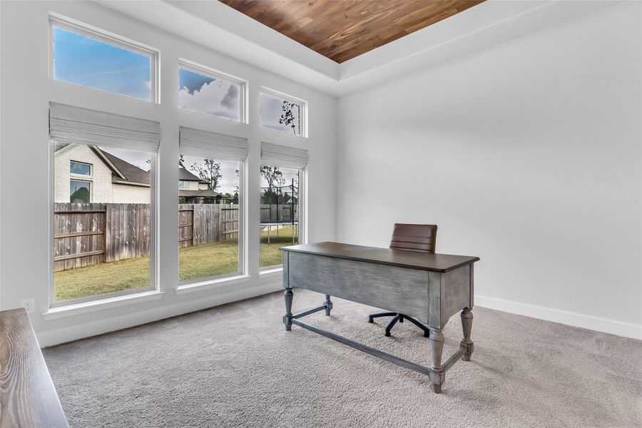 Private office with French doors. Can also be used as a game room.
