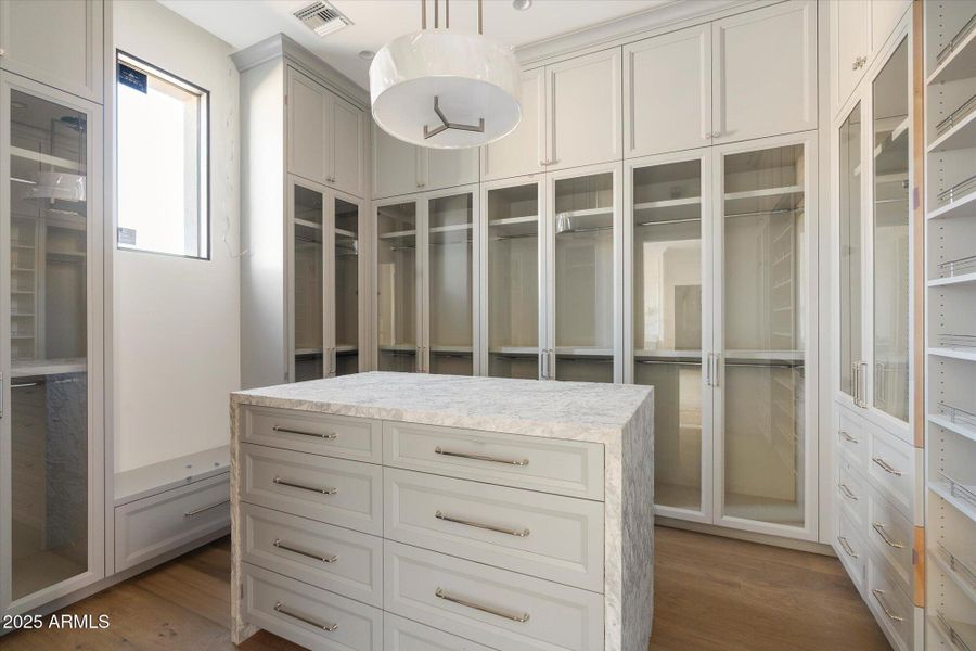 1 of 2 Primary Closets 1 of 2 Primary Closets