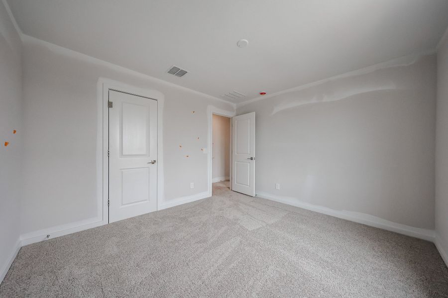 A hallway with white doors. A hallway with white doors.