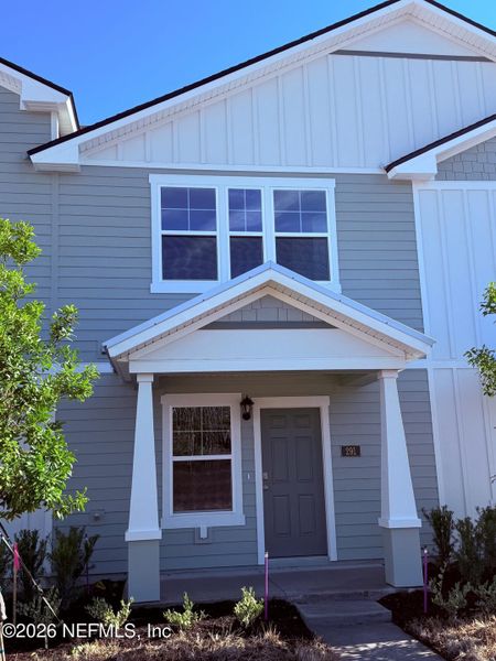 Front exterior of a new home in Liberty Cove, Yulee, FL, highlighting curb appeal (Image 2).