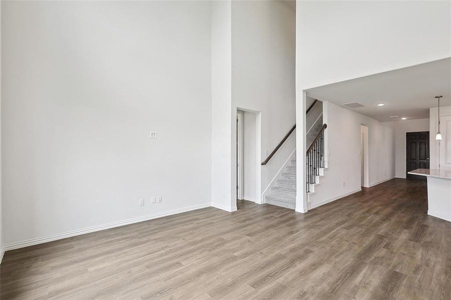 Unfurnished living room with hardwood / wood-style flooring