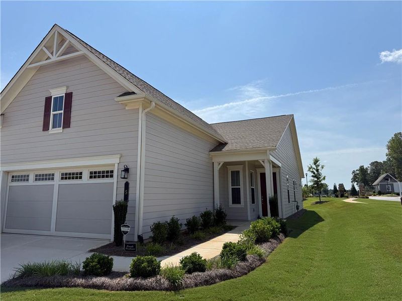 Front exterior of a new home in , Newnan, GA, highlighting curb appeal (Image 1). Front exterior of a new home in , Newnan, GA, highlighting curb appeal (Image 1).