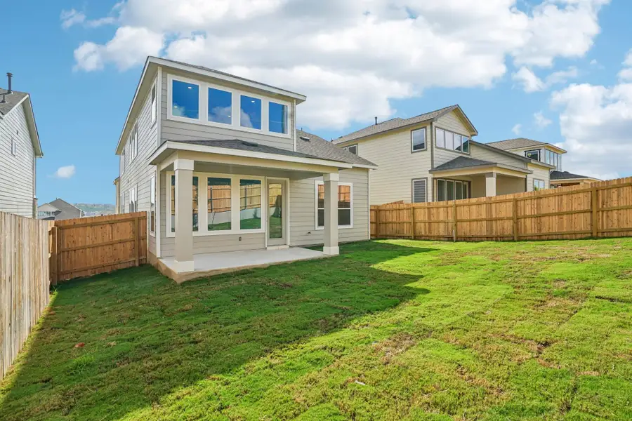 Exterior details and patio area of a home in The Meadows at Hunters Ranch, San Antonio (Image 21).