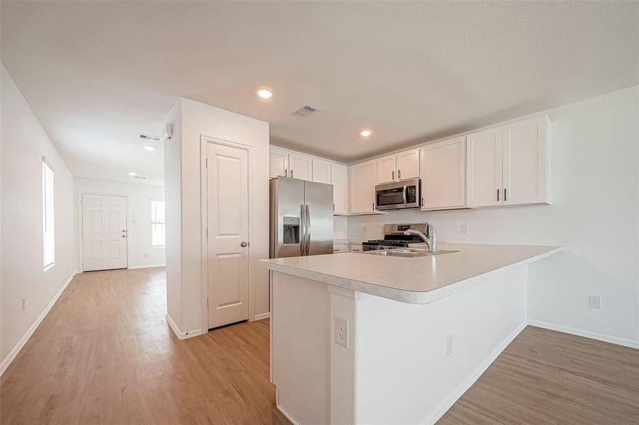 The heart of the home, the kitchen, is front and center in this open-concept layout, making it perfect for gatherings and family time!