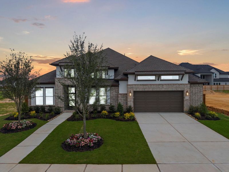 Front exterior of a new home in Dunham Pointe, Cypress, TX, highlighting curb appeal (Image 1). Front exterior of a new home in Dunham Pointe, Cypress, TX, highlighting curb appeal (Image 1).