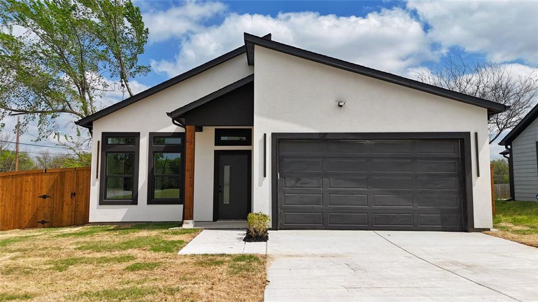 Front exterior of a new home in , Greenville, TX, highlighting curb appeal (Image 1). Front exterior of a new home in , Greenville, TX, highlighting curb appeal (Image 1).