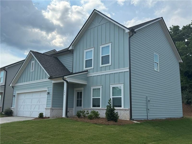 Front exterior of a new home in Langston Reserve, Cartersville, GA, highlighting curb appeal (Image 2). Front exterior of a new home in Langston Reserve, Cartersville, GA, highlighting curb appeal (Image 2).