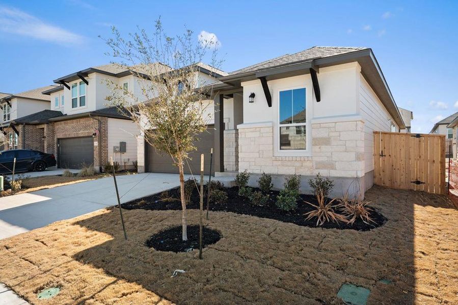 Front exterior of a new home in Park Central, Georgetown, TX, highlighting curb appeal (Image 21).