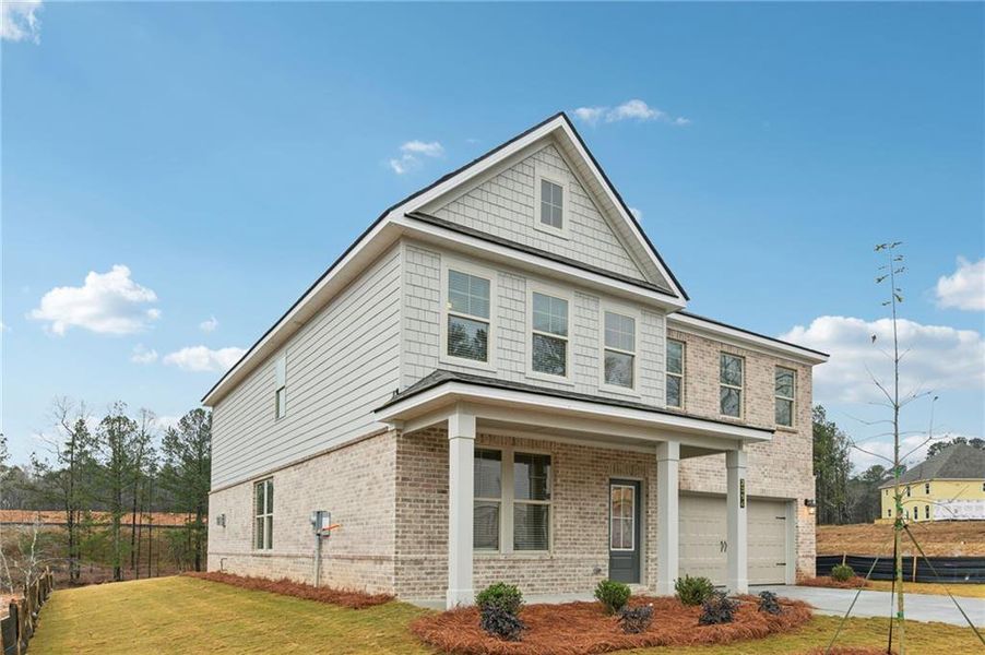 Front exterior of a new home in Hamilton Lakes, Lawrenceville, GA, highlighting curb appeal (Image 21).