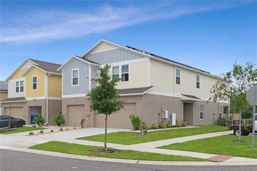 Front exterior of a new home in , Haines City, FL, highlighting curb appeal (Image 19).