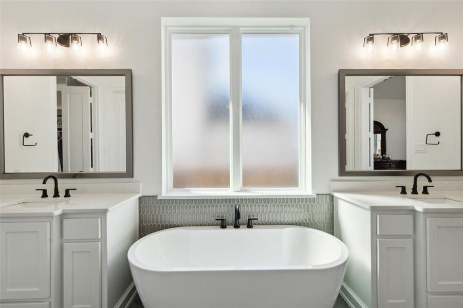 Bathroom featuring vanity and a bathtub