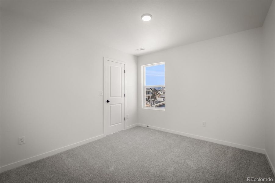 Spacious, unfurnished interior of a new home in Revel Crossing at Wolf Ranch – The Ascent Collection, Colorado Springs (Image 27).