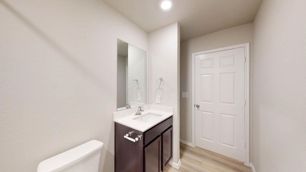 A well-appointed bath features a sleek vanity with ample storage and contemporary fixtures. A well-appointed bath features a sleek vanity with ample storage and contemporary fixtures.