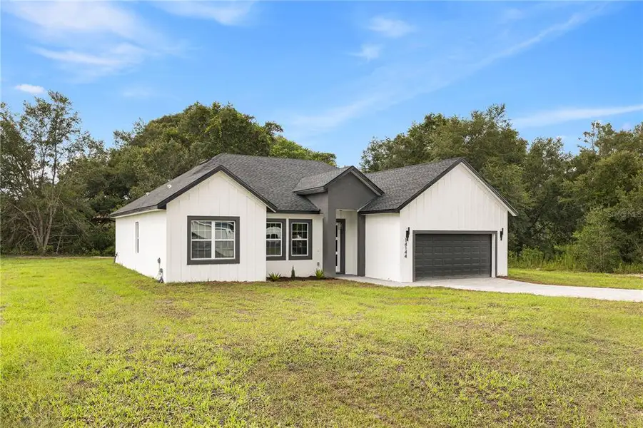 Front exterior of a new home in , Ocala, FL, highlighting curb appeal (Image 2). Front exterior of a new home in , Ocala, FL, highlighting curb appeal (Image 2).