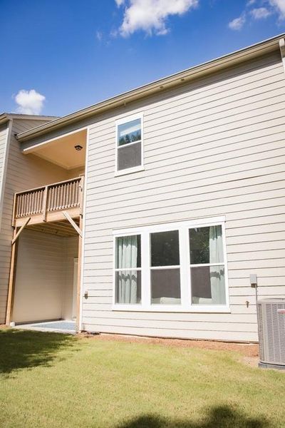 Front exterior of a new home in , Woodstock, GA, highlighting curb appeal (Image 1).