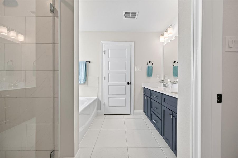 A stunning perspective of the primary suite featuring an elegant transition from the custom-built walk-in closet directly into the serene and expansive primary bedroom. This open-concept design highlights the seamless flow and intentional architectural connection between the organized closet storage space and the peaceful, luxurious sleeping quarters, perfectly capturing the spacious, functional, and inviting layout of the home's most private retreat. A stunning perspective of the primary suite featuring an elegant transition from the custom-built walk-in closet directly into the serene and expansive primary bedroom. This open-concept design highlights the seamless flow and intentional architectural connection between the organized closet storage space and the peaceful, luxurious sleeping quarters, perfectly capturing the spacious, functional, and inviting layout of the home's most private retreat.