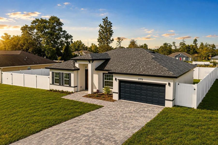 Front exterior of a new home in , Ocala, FL, highlighting curb appeal (Image 2). Front exterior of a new home in , Ocala, FL, highlighting curb appeal (Image 2).
