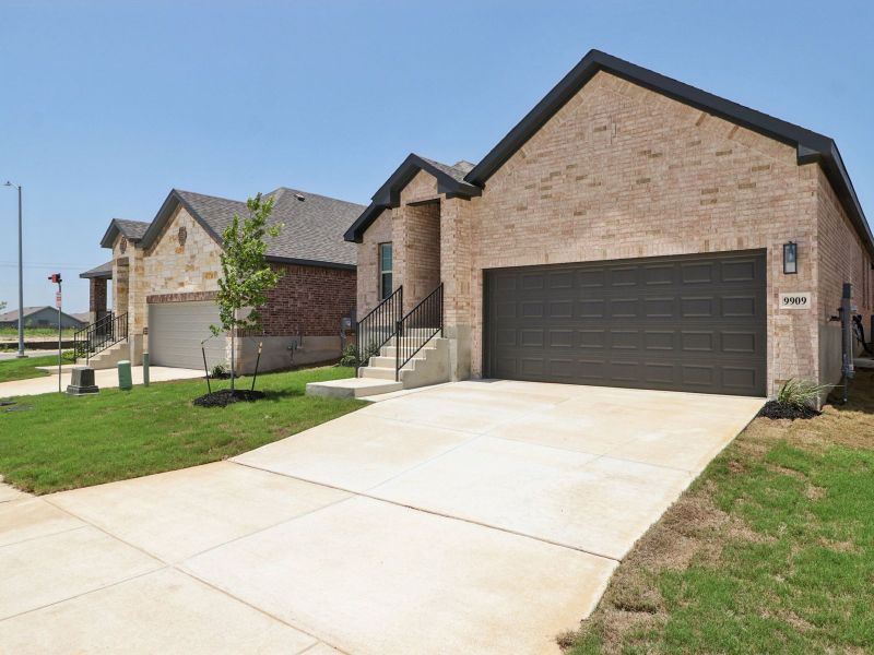 Front exterior of a new home in Kallison Ranch, San Antonio, TX, highlighting curb appeal (Image 20).