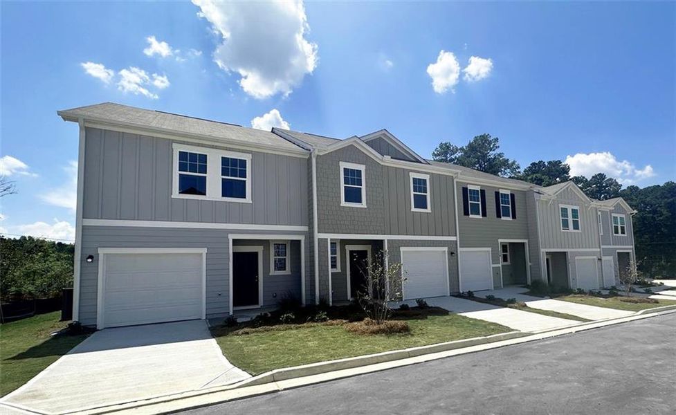 Front exterior of a new home in Chestnut Grove, Douglasville, GA, highlighting curb appeal (Image 1). Front exterior of a new home in Chestnut Grove, Douglasville, GA, highlighting curb appeal (Image 1).